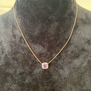 amethyst-colored stone with clear crystals necklace.
